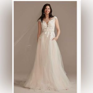 David’s Bridal wedding gown size 16W. I will include the dress bag for free.